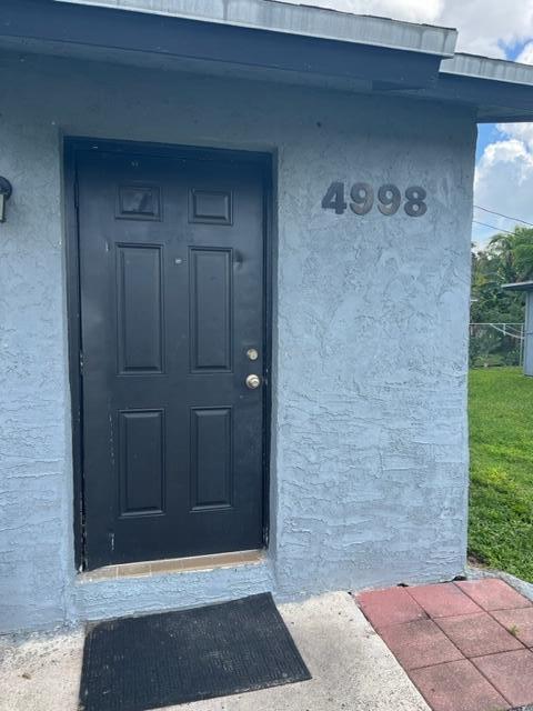 4998 Kirk Road Lake Worth, FL 33461 - Photo 2 of 22 a view of a wooden door