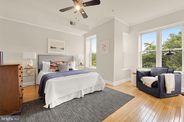 a bedroom with a bed and a couch