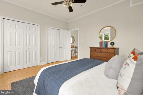 a bedroom with a bed and a dresser