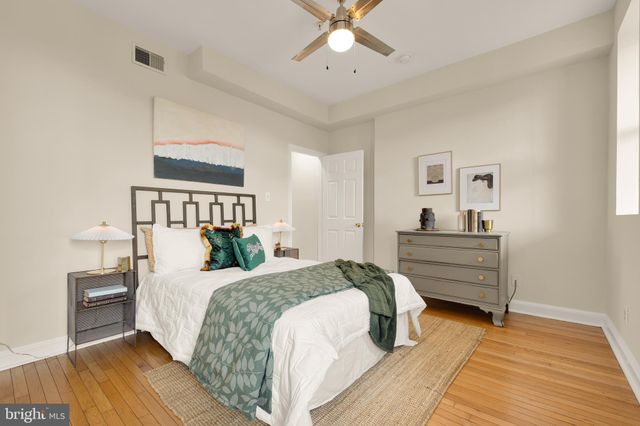 a bedroom with a bed and a dresser