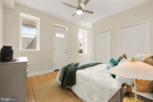 a bedroom with a bed and window