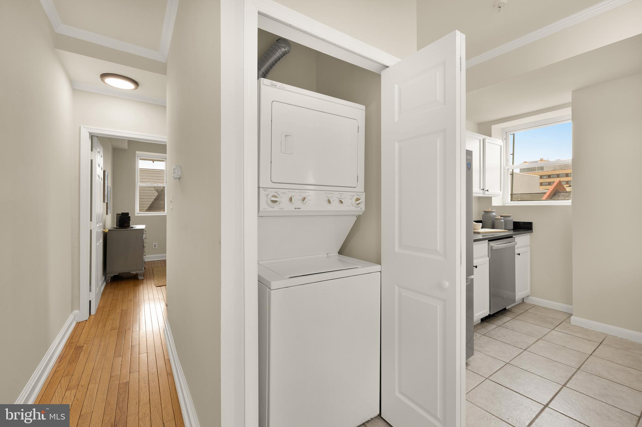 1458 Fairmont Street Northwest, Unit 4 Washington, DC 20009 - Photo 20 of 24 a view of a hallway with washer and dryer