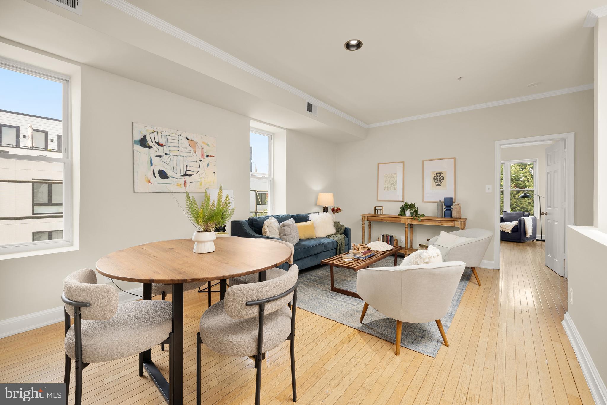 1458 Fairmont Street Northwest, Unit 4 Washington, DC 20009 - Photo 6 of 24 a living room with furniture a wooden floor and a table