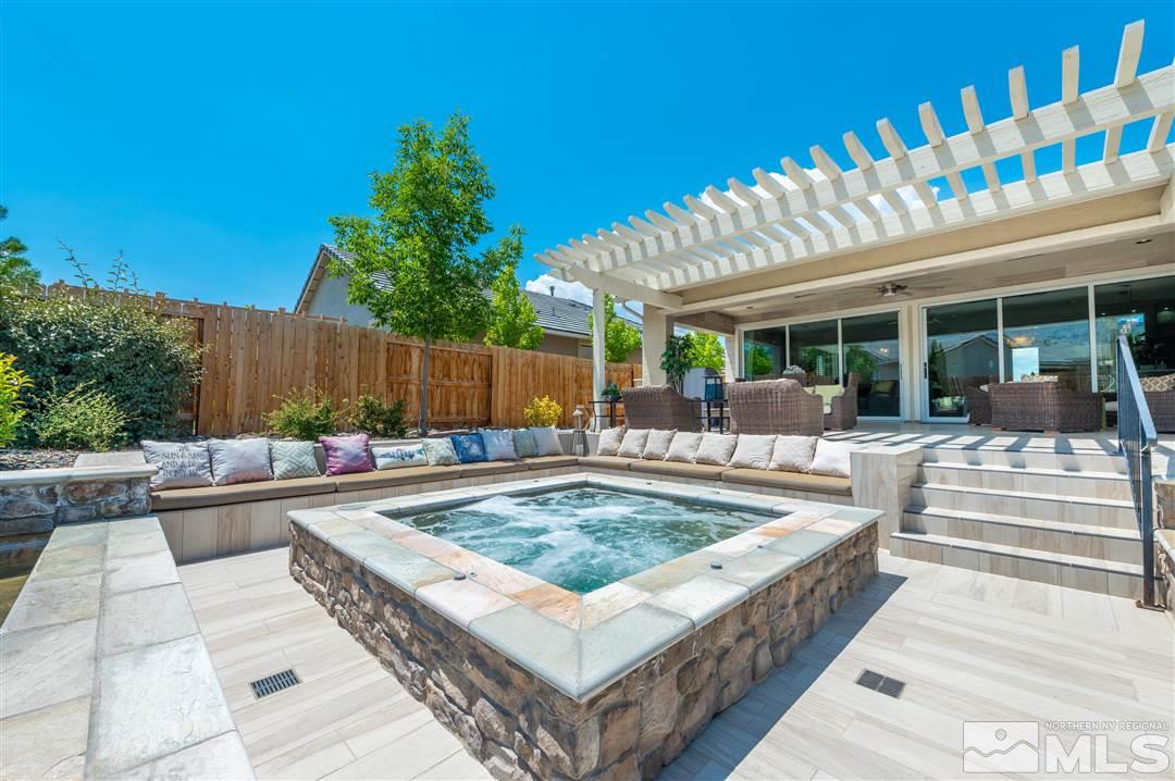 9920 Hafflinger Lane Reno, NV 89521 - Photo 36 of 36 a view of a backyard with swimming pool and furniture