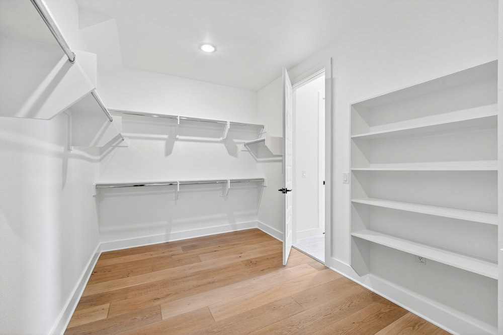 2707 Salek View Austin, TX 78741 - Photo 24 of 39 Walk in closet with light wood-style flooring