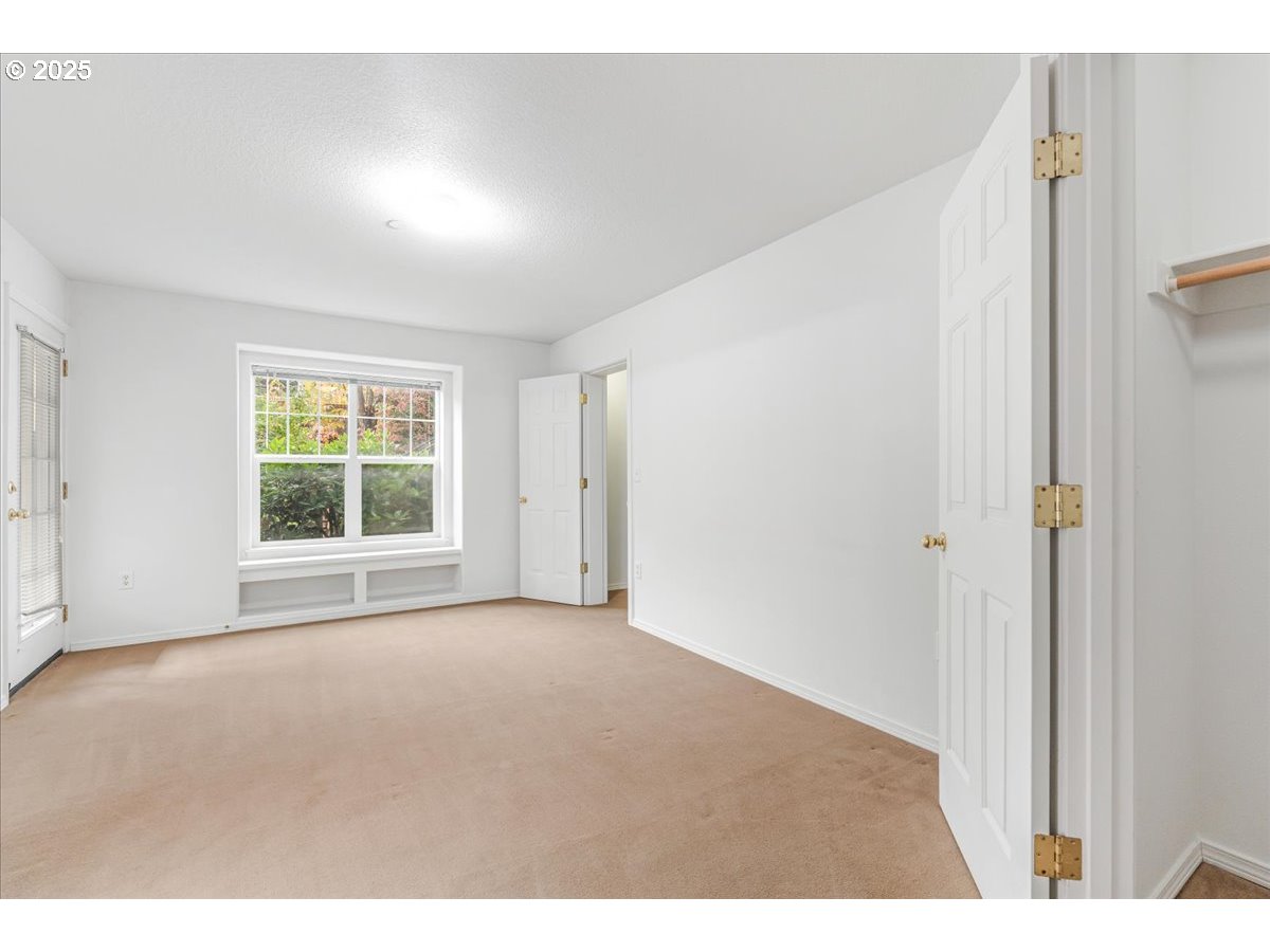 30424 Southwest Ruth Street, Unit 84 Wilsonville, OR 97070 - Photo 20 of 48 a view of an empty room with a window