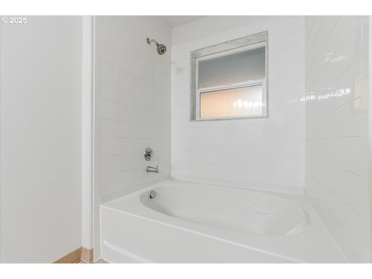 30424 Southwest Ruth Street, Unit 84 Wilsonville, OR 97070 - Photo 23 of 48 a bathroom with a bathtub