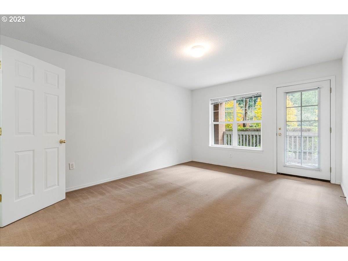 30424 Southwest Ruth Street, Unit 84 Wilsonville, OR 97070 - Photo 29 of 48 a view of an empty room with a window