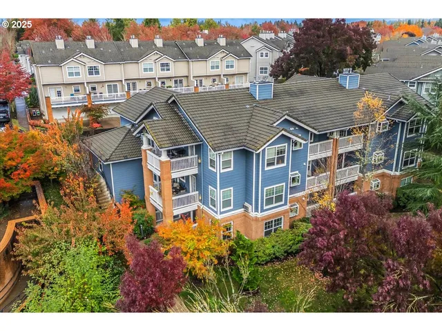 an aerial view of a house with a big yard