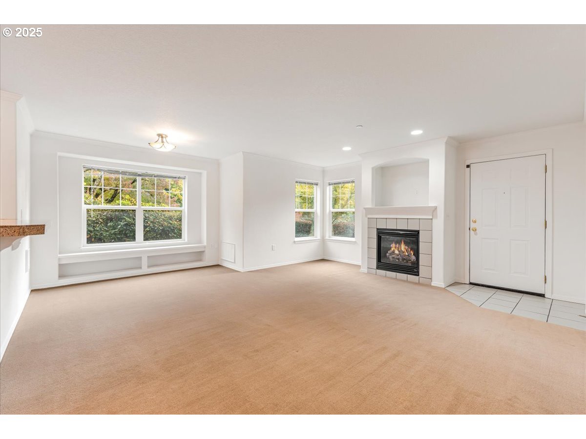 30424 Southwest Ruth Street, Unit 84 Wilsonville, OR 97070 - Photo 9 of 48 a view of empty room with a fireplace