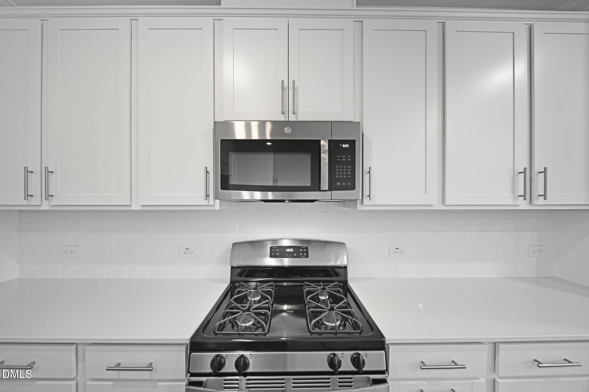 2946 Hickory Fld Drive Raleigh, NC 27616 - Photo 11 of 30 a stove top oven sitting inside of a kitchen