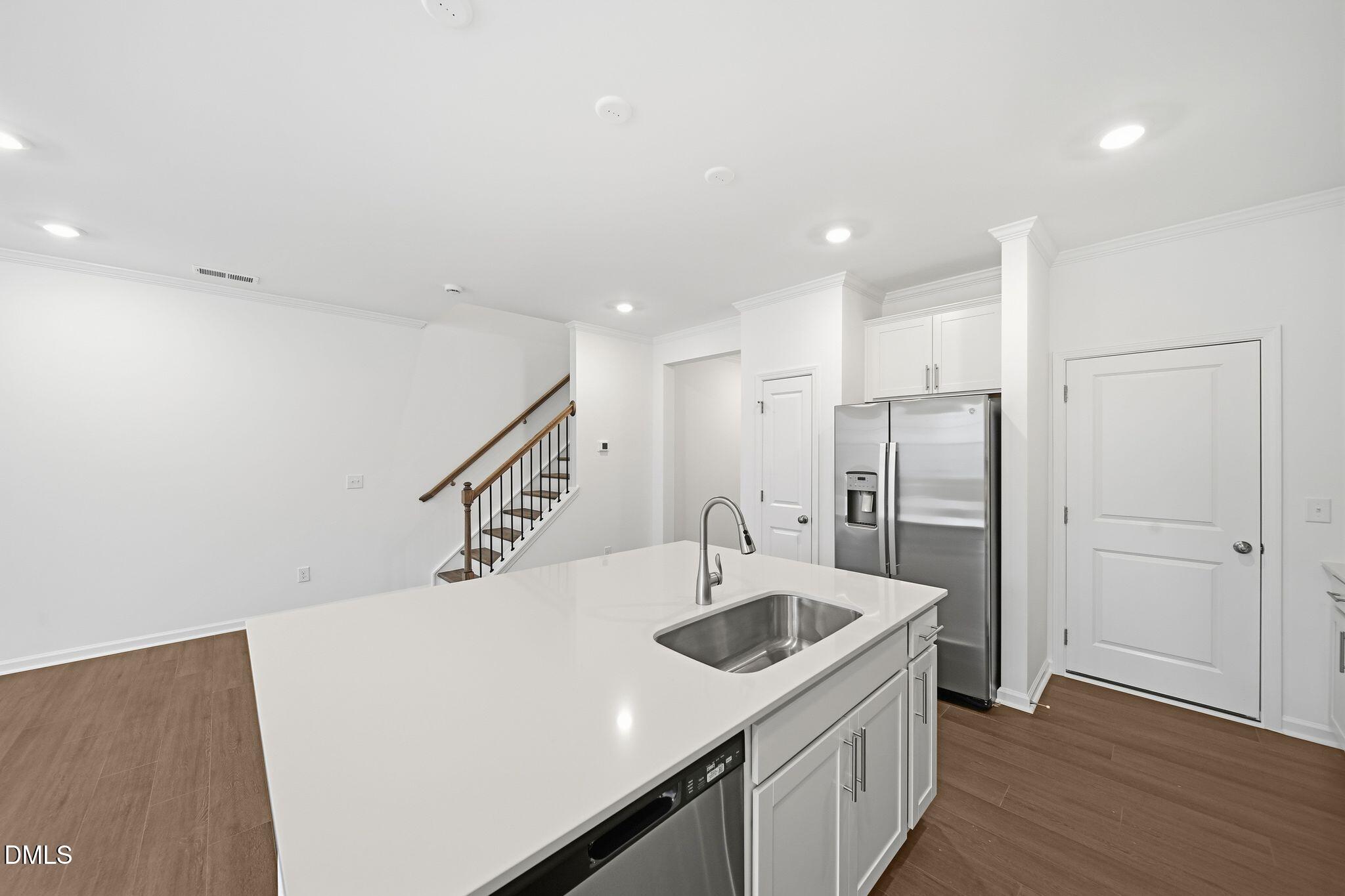 2946 Hickory Fld Drive Raleigh, NC 27616 - Photo 13 of 30 a kitchen with a sink a refrigerator and a stove top oven