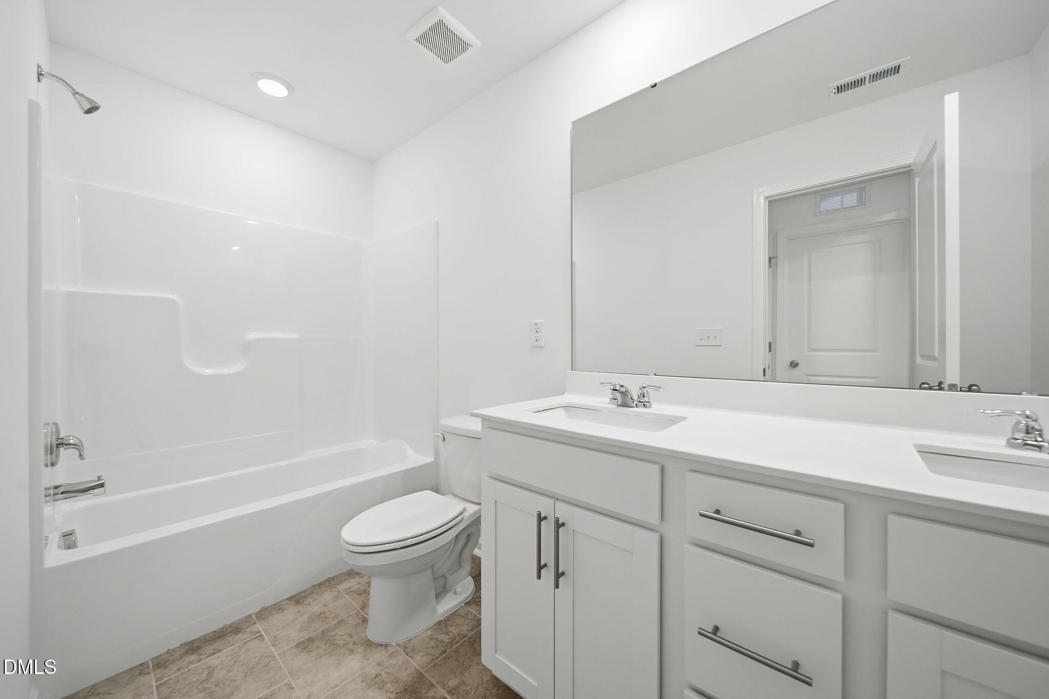 2946 Hickory Fld Drive Raleigh, NC 27616 - Photo 14 of 30 a bathroom with a sink a toilet and a bathtub