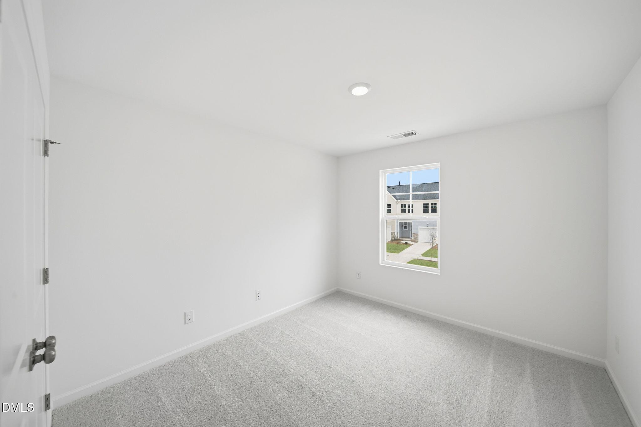 2946 Hickory Fld Drive Raleigh, NC 27616 - Photo 17 of 30 a view of an empty room with a window
