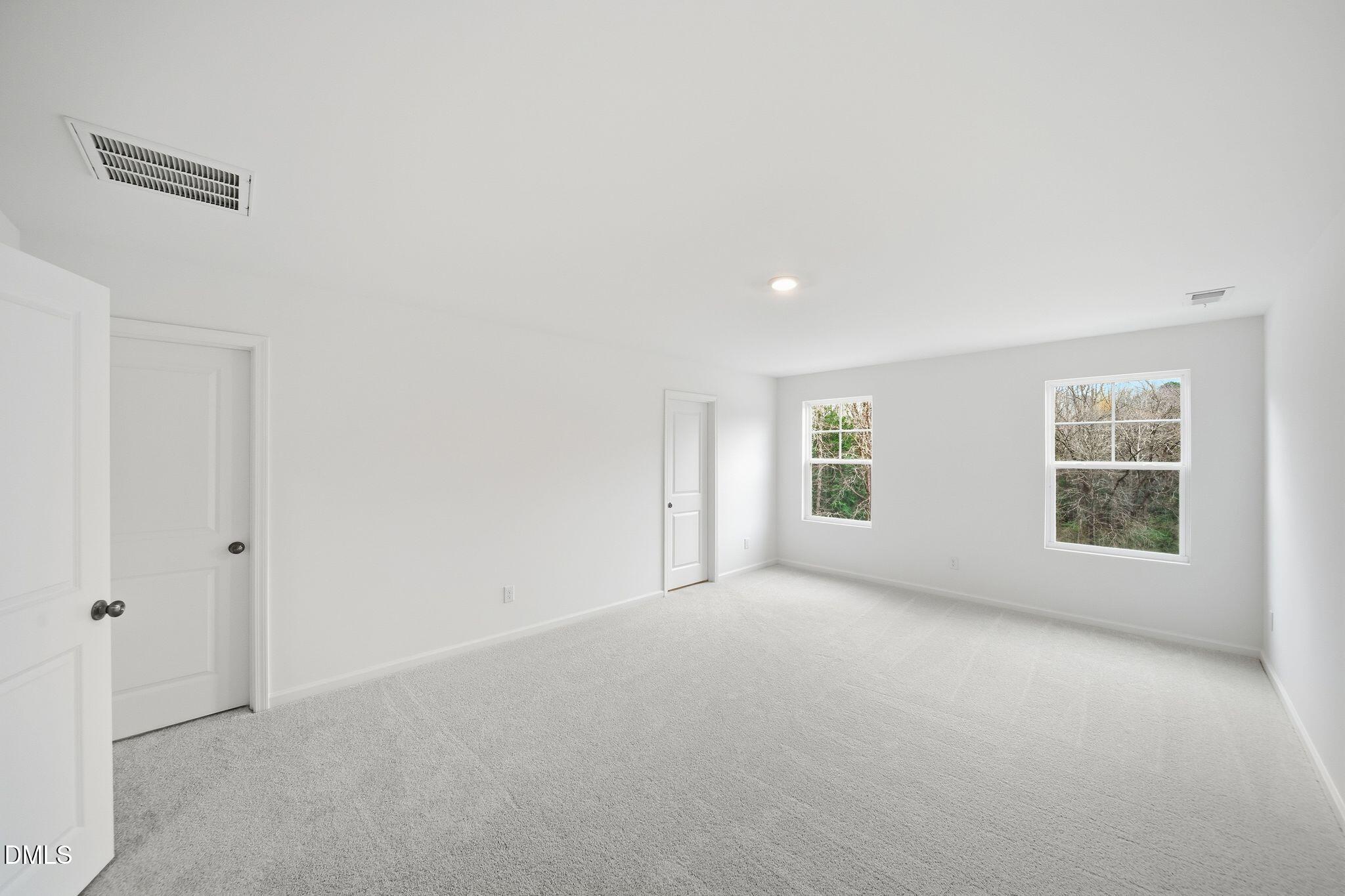 2946 Hickory Fld Drive Raleigh, NC 27616 - Photo 22 of 30 an empty room with windows
