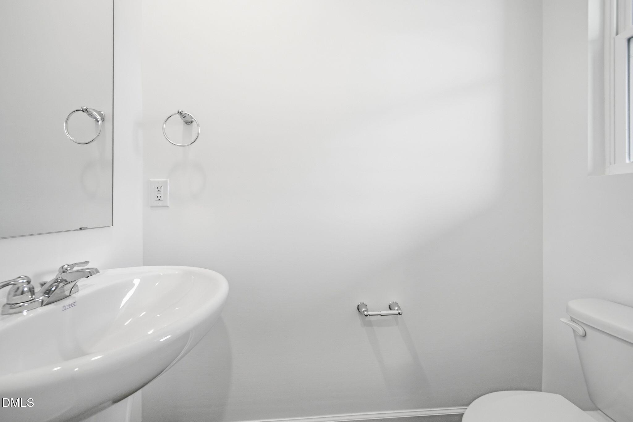 2946 Hickory Fld Drive Raleigh, NC 27616 - Photo 27 of 30 a bathroom with a sink and a toilet