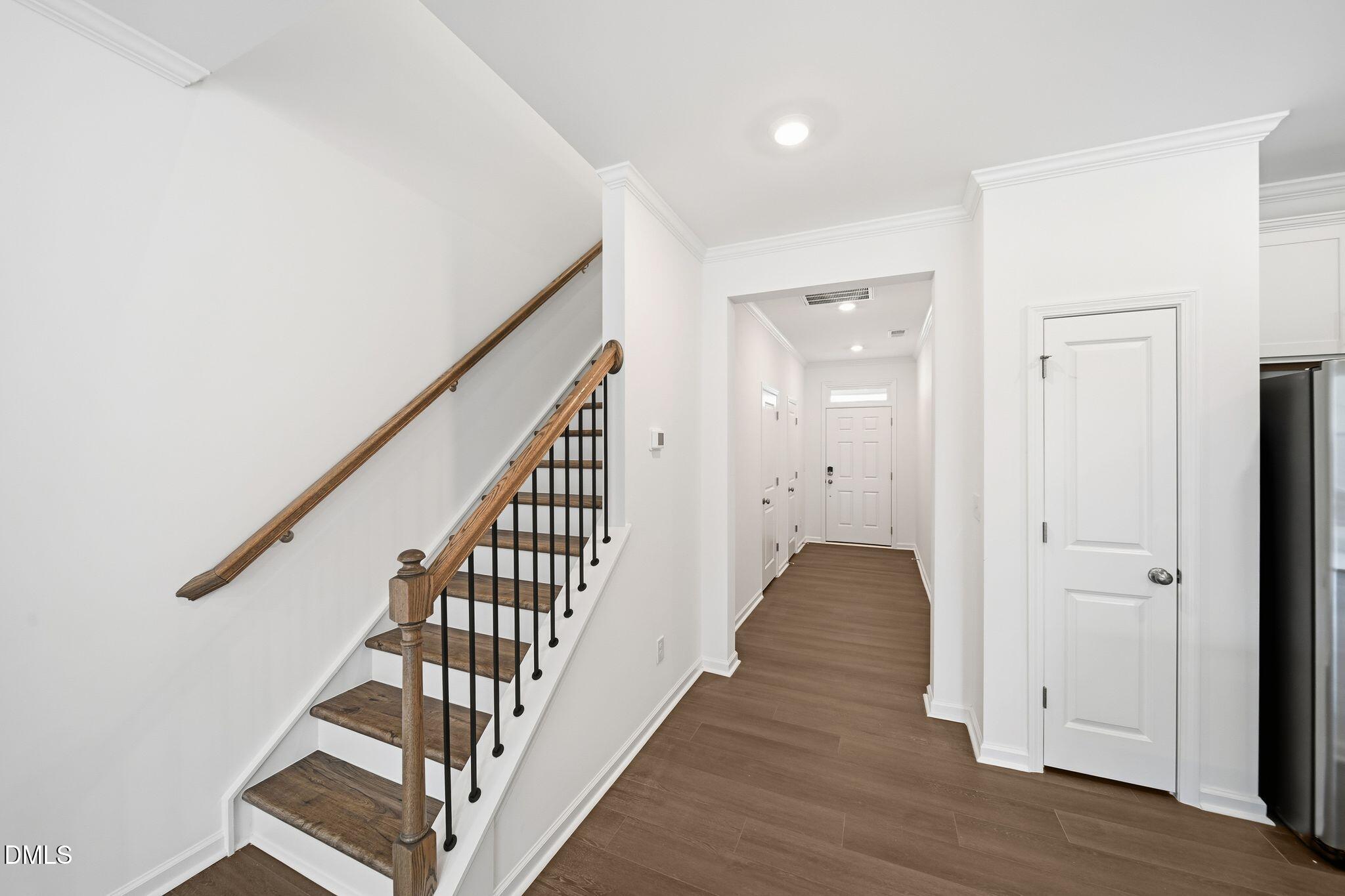 2946 Hickory Fld Drive Raleigh, NC 27616 - Photo 3 of 30 a view of a hallway with wooden floor and staircase