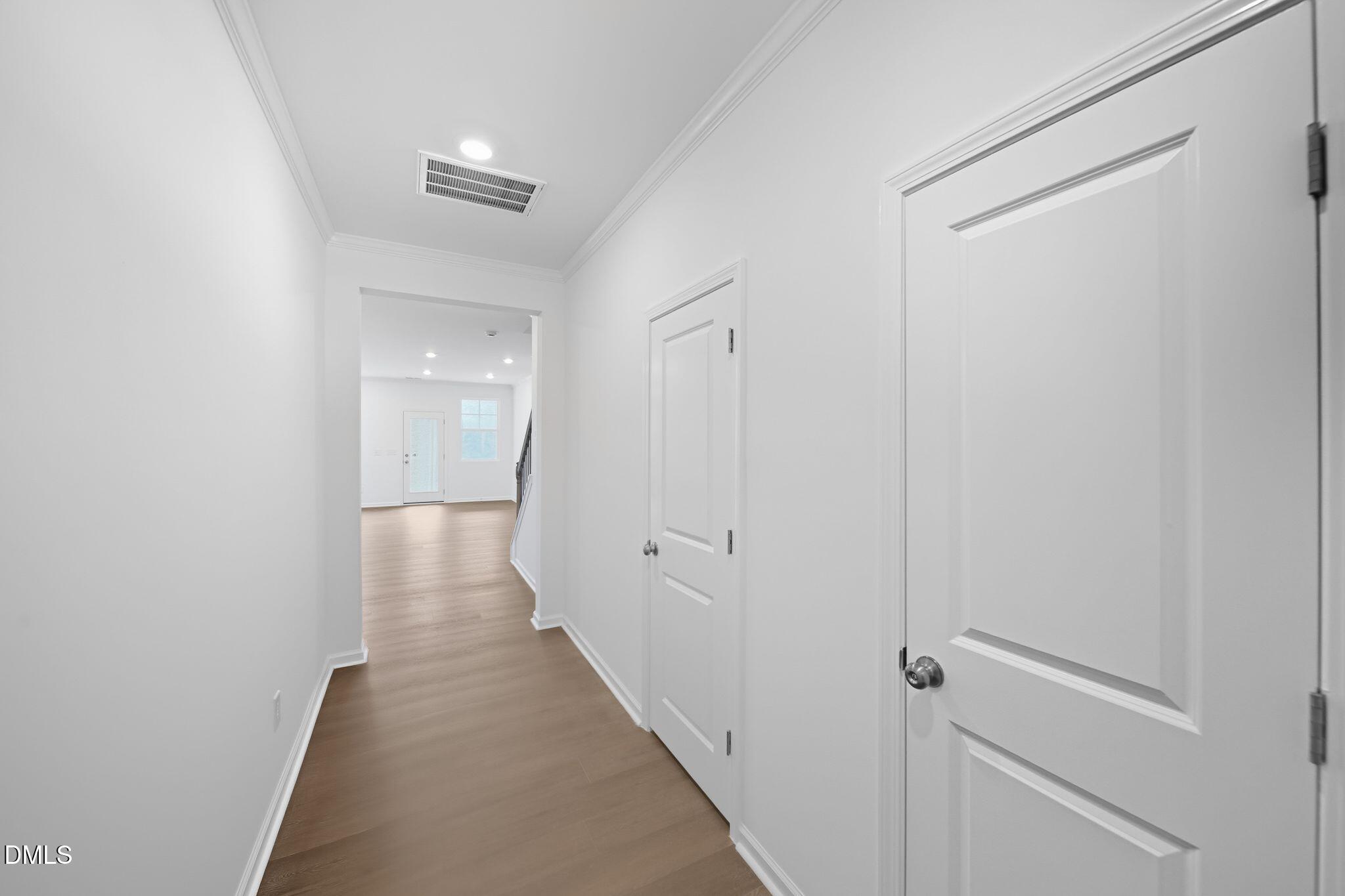 2946 Hickory Fld Drive Raleigh, NC 27616 - Photo 4 of 30 a view of a hallway with wooden floor