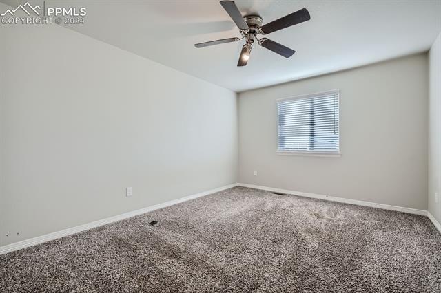 6126 Jorie Road Colorado Springs, CO 80927 - Photo 15 of 28 Carpeted empty room with ceiling fan