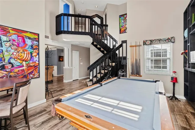 a view of entryway with wooden floor and stairs