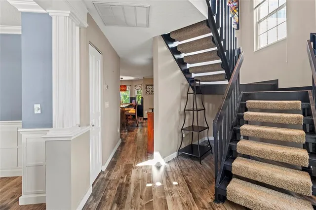 a view of a dining room with furniture window and wooden floor