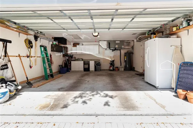 a kitchen with stainless steel appliances granite countertop a stove and a refrigerator