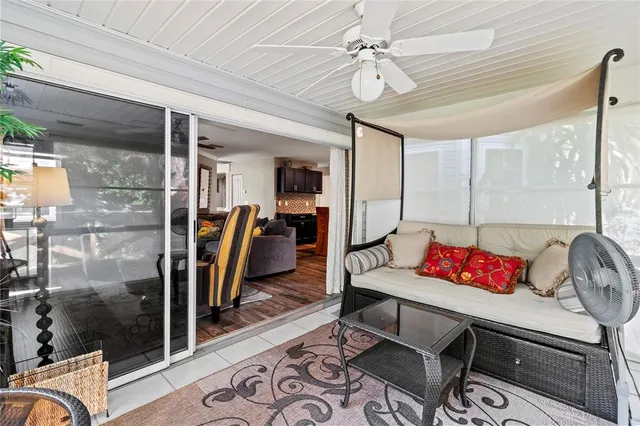 a bedroom with a bed table closet and a window