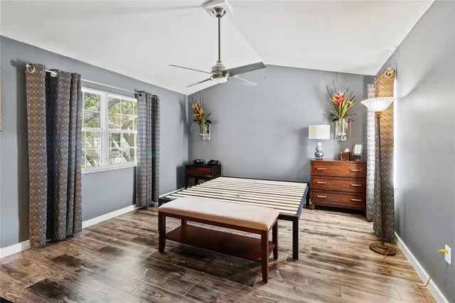 a white bath tub sitting in a bathroom next to a window