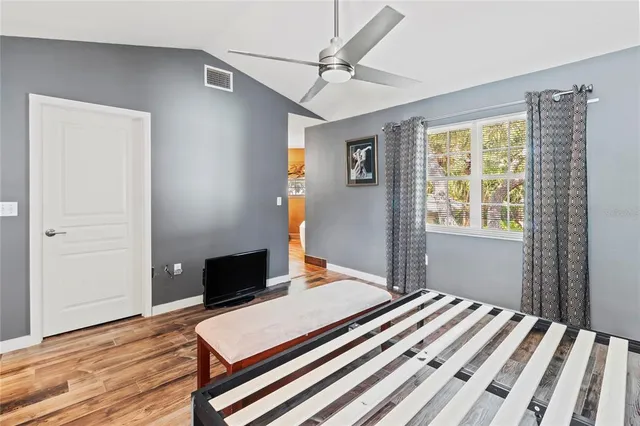 a bathroom with a granite countertop sink a mirror and a shower