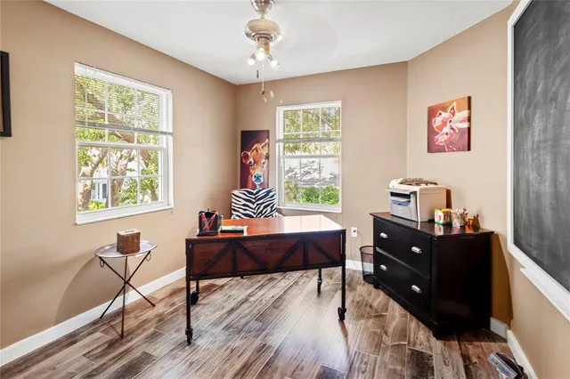 a view of a backyard with sitting area