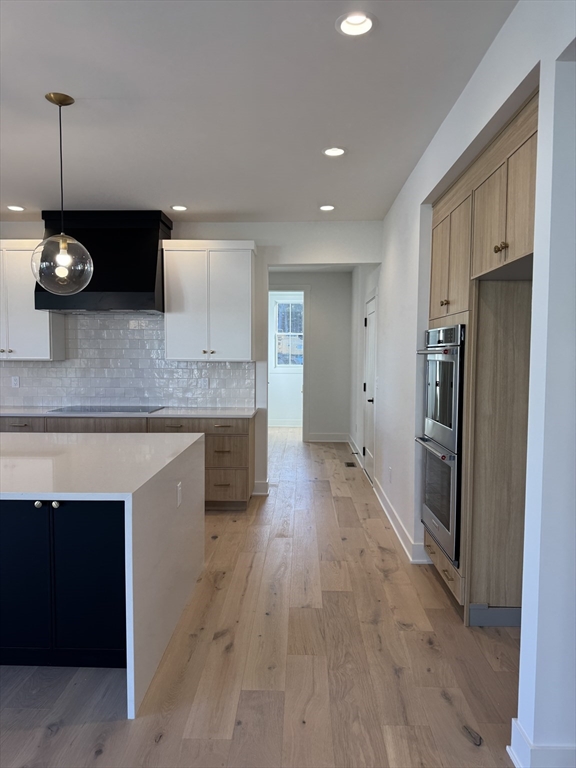 12 Old County Road, Unit 20 Hudson, MA 01749 - Photo 20 of 30 a kitchen with stainless steel appliances granite countertop a stove a refrigerator and a sink