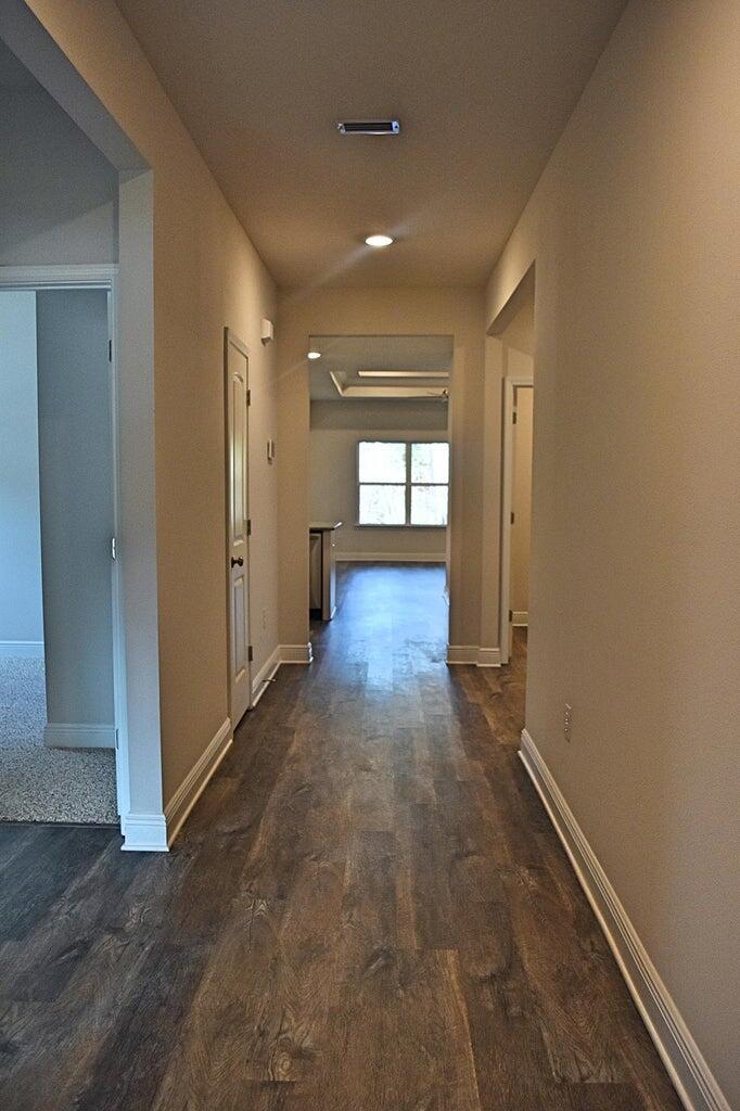 131 Southern Pnes Road Santa Rosa Beach, FL 32459 - Photo 2 of 4 an empty room with wooden floor and windows