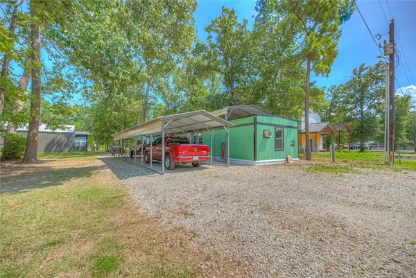 a view of a house with a yard and garage