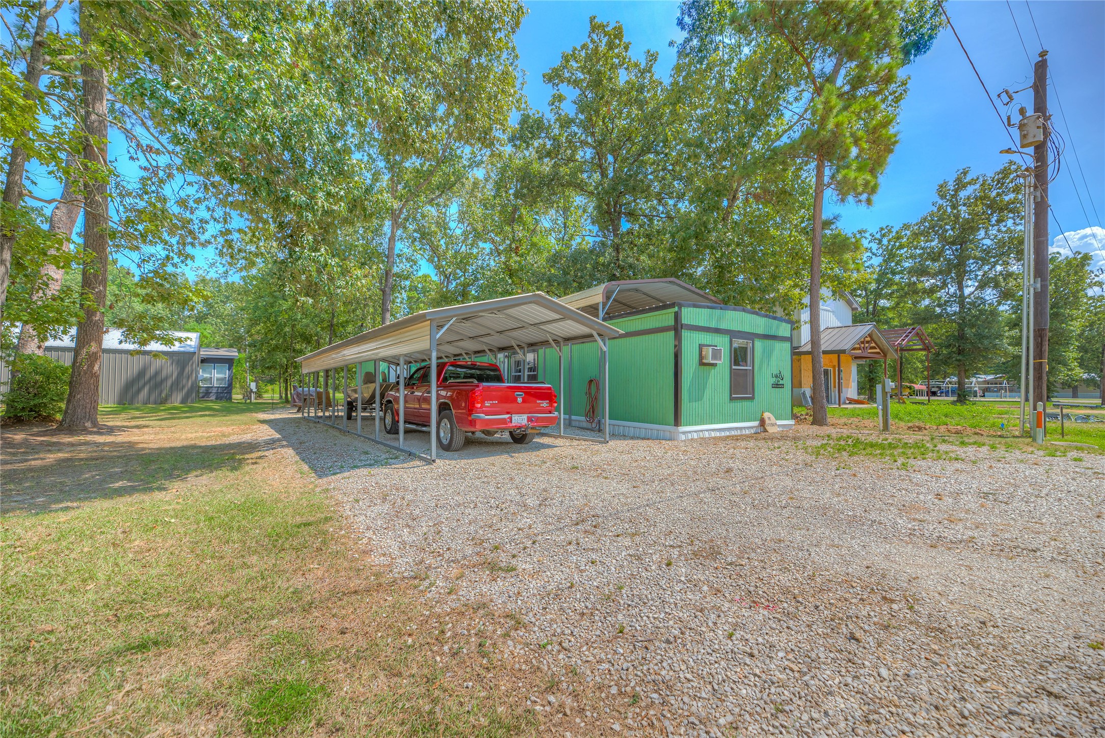 191 Trinidad Lane Point Blank, TX 77364 - Photo 26 of 29 ANOTHER VIEW OF THIS ON 2 BEDROOM, 1 .5 BATHROOM SITE BUILT HOME-12 X 46 METAL CARPORT