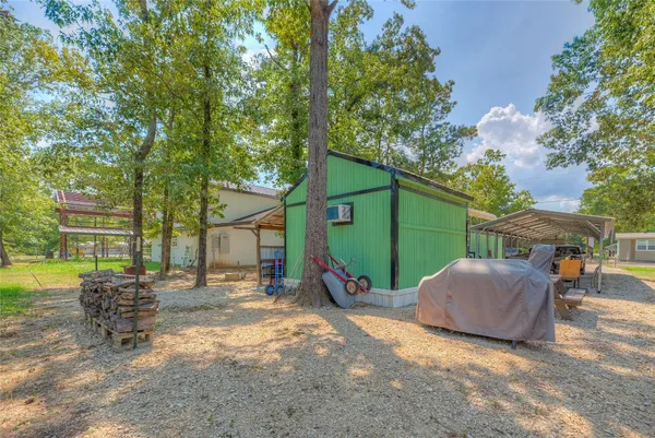 a view of backyard of house with seating space