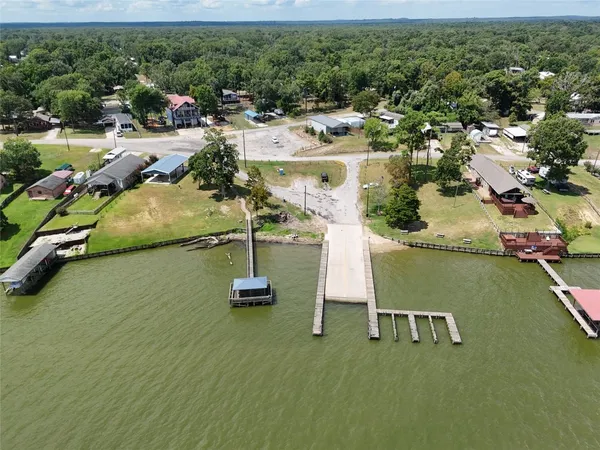 an aerial view of a house with a yard