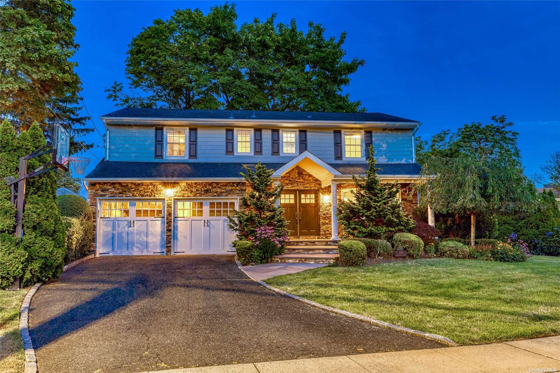 2461 Lindenmere Drive Merrick, NY 11566 - Photo 1 of 1 a front view of a house with a yard