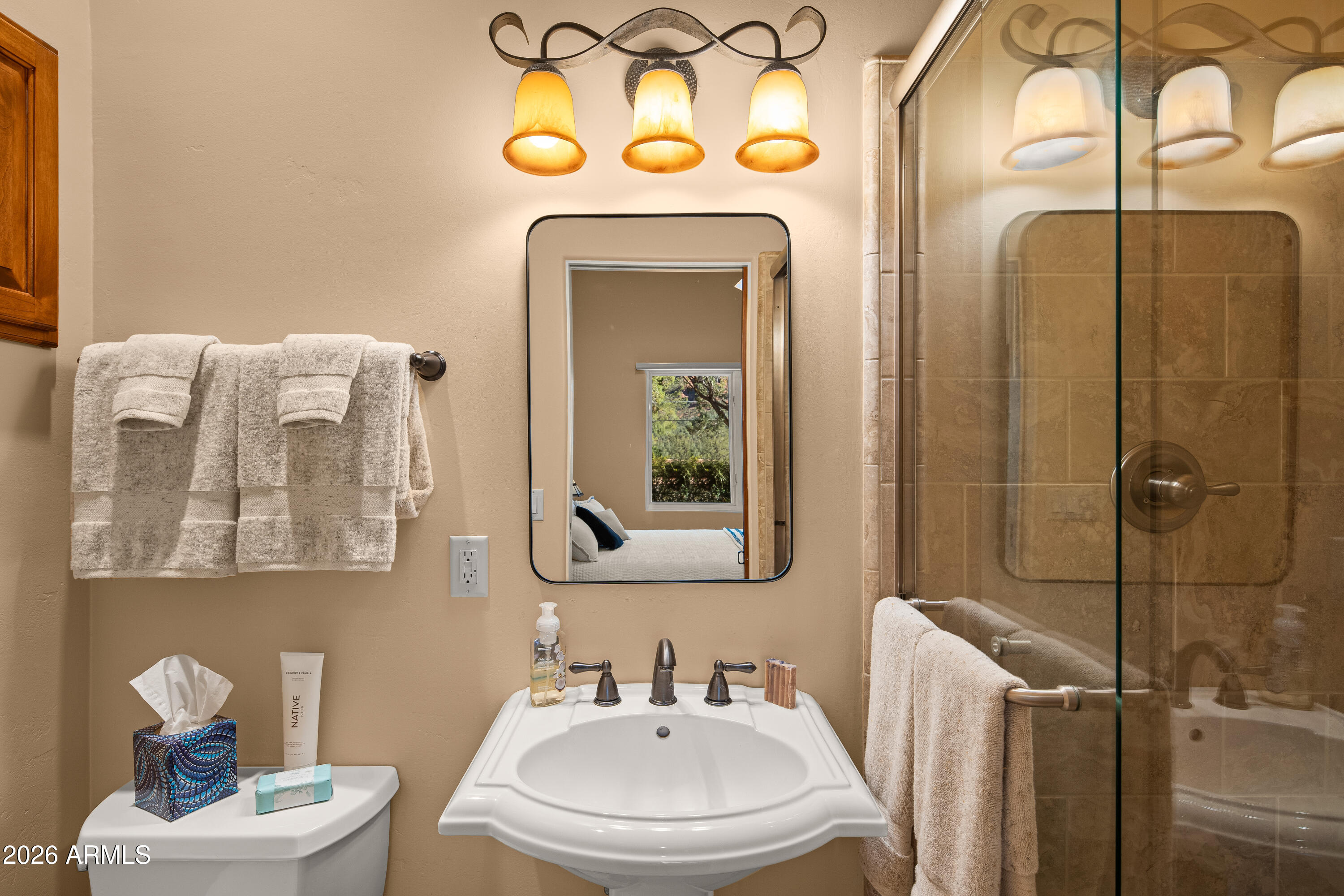 190 Morgan Road Sedona, AZ 86336 - Photo 49 of 51 a bathroom with a toilet sink and mirror