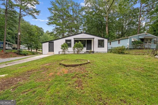 a front view of a house with a yard