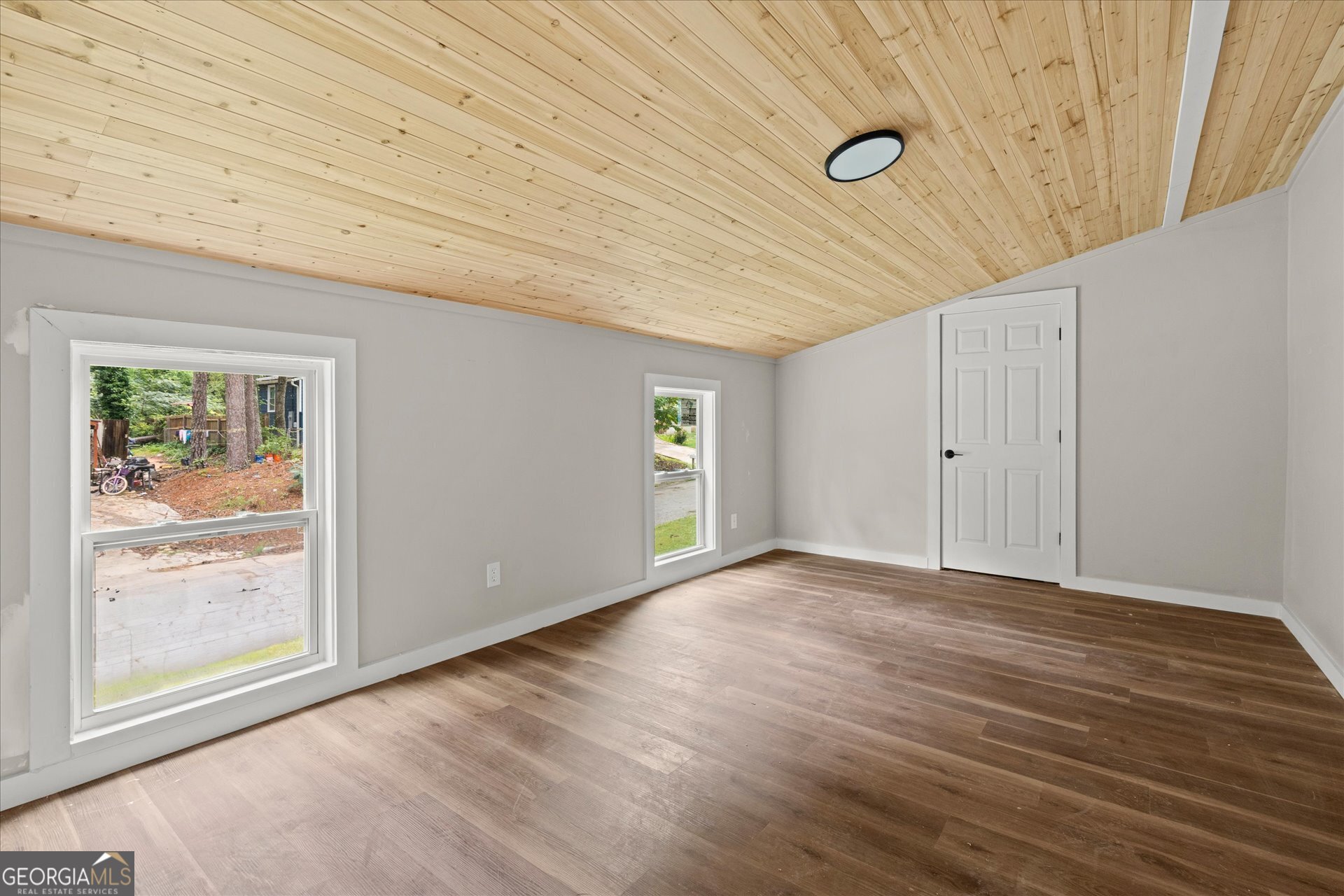 3102 McKenzie Road East Point, GA 30344 - Photo 13 of 31 a view of an empty room with window and wooden floor