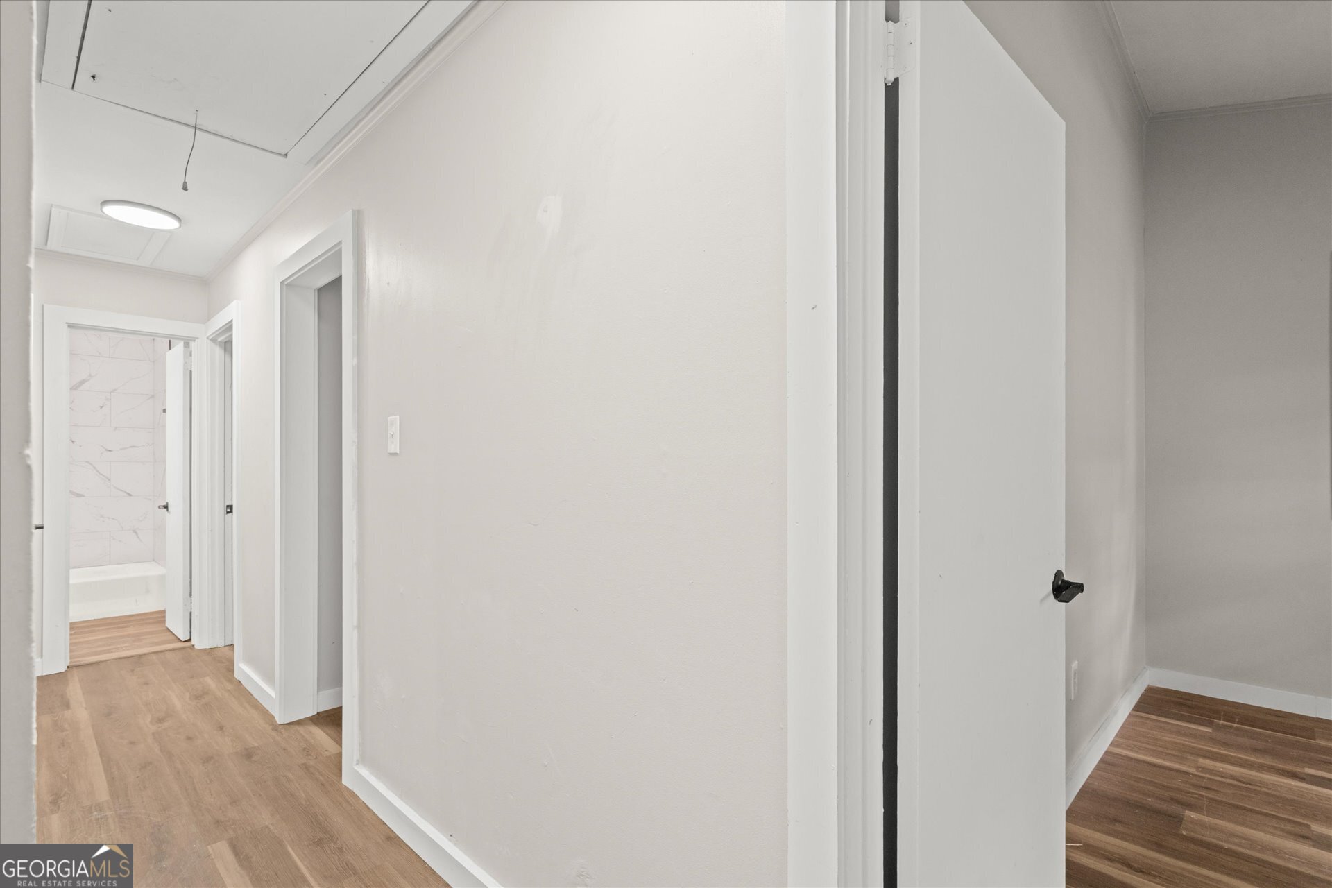 3102 McKenzie Road East Point, GA 30344 - Photo 15 of 31 a view of a hallway with wooden floor and staircase