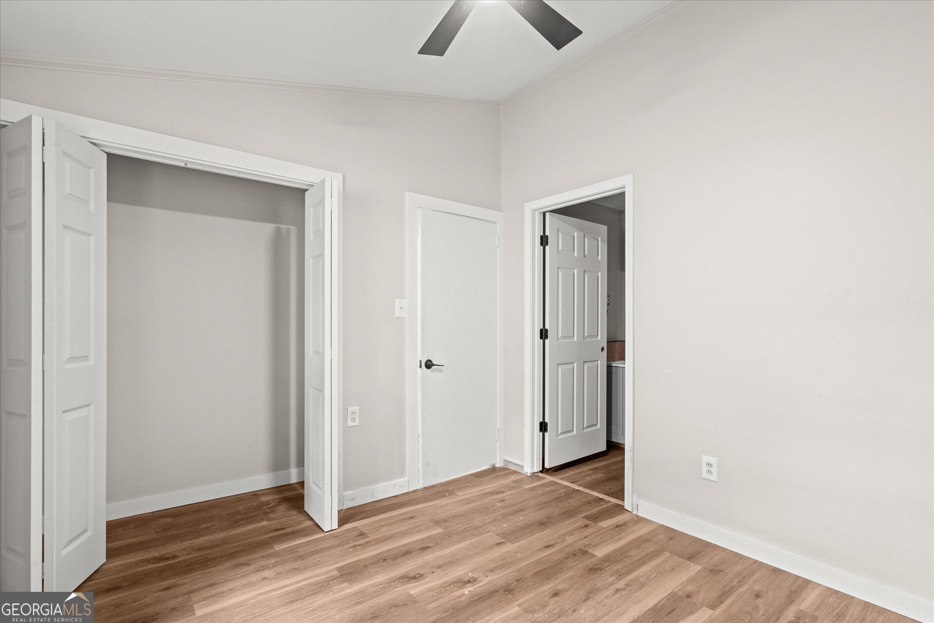 3102 McKenzie Road East Point, GA 30344 - Photo 19 of 31 a view of an empty room with wooden floor and closet