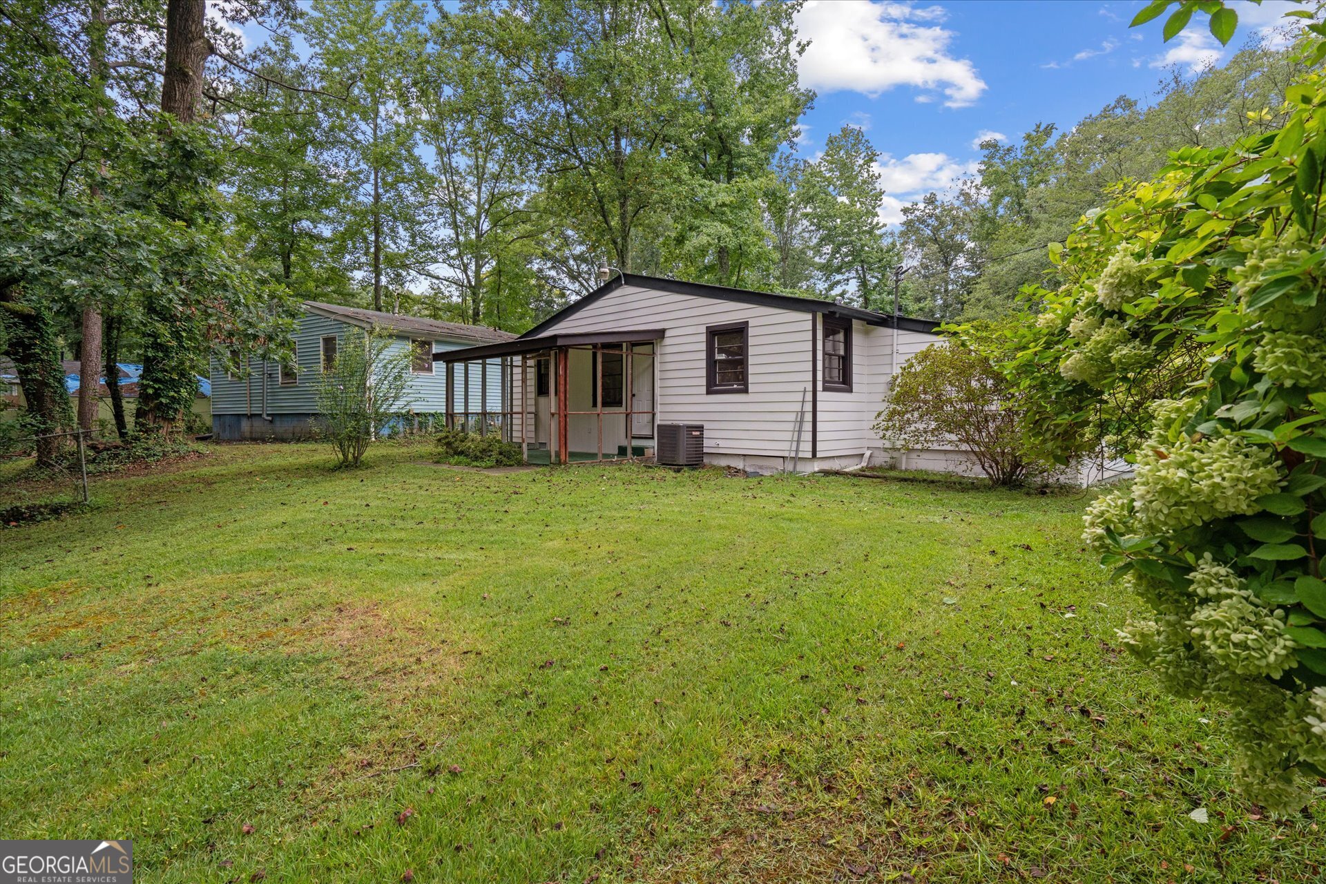 3102 McKenzie Road East Point, GA 30344 - Photo 26 of 31 a view of a house with a yard