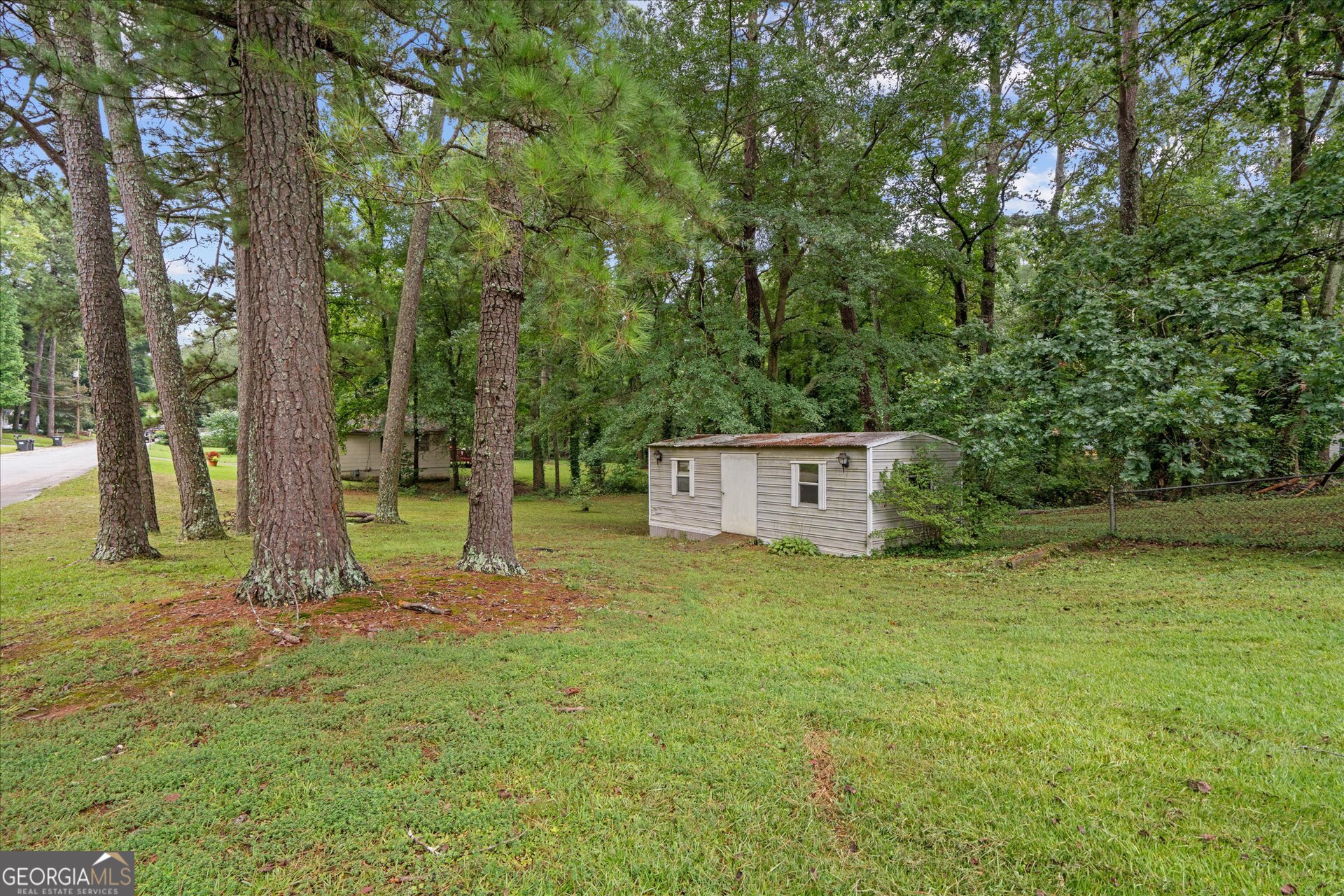 3102 McKenzie Road East Point, GA 30344 - Photo 28 of 31 a view of a house with a yard