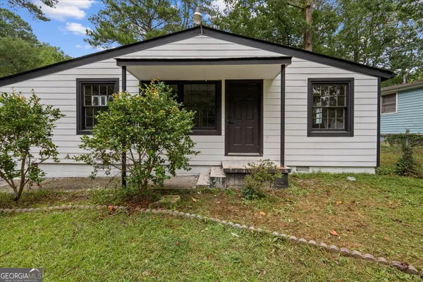 front view of a house with a yard