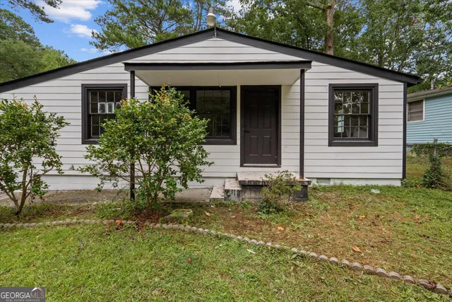 front view of a house with a yard