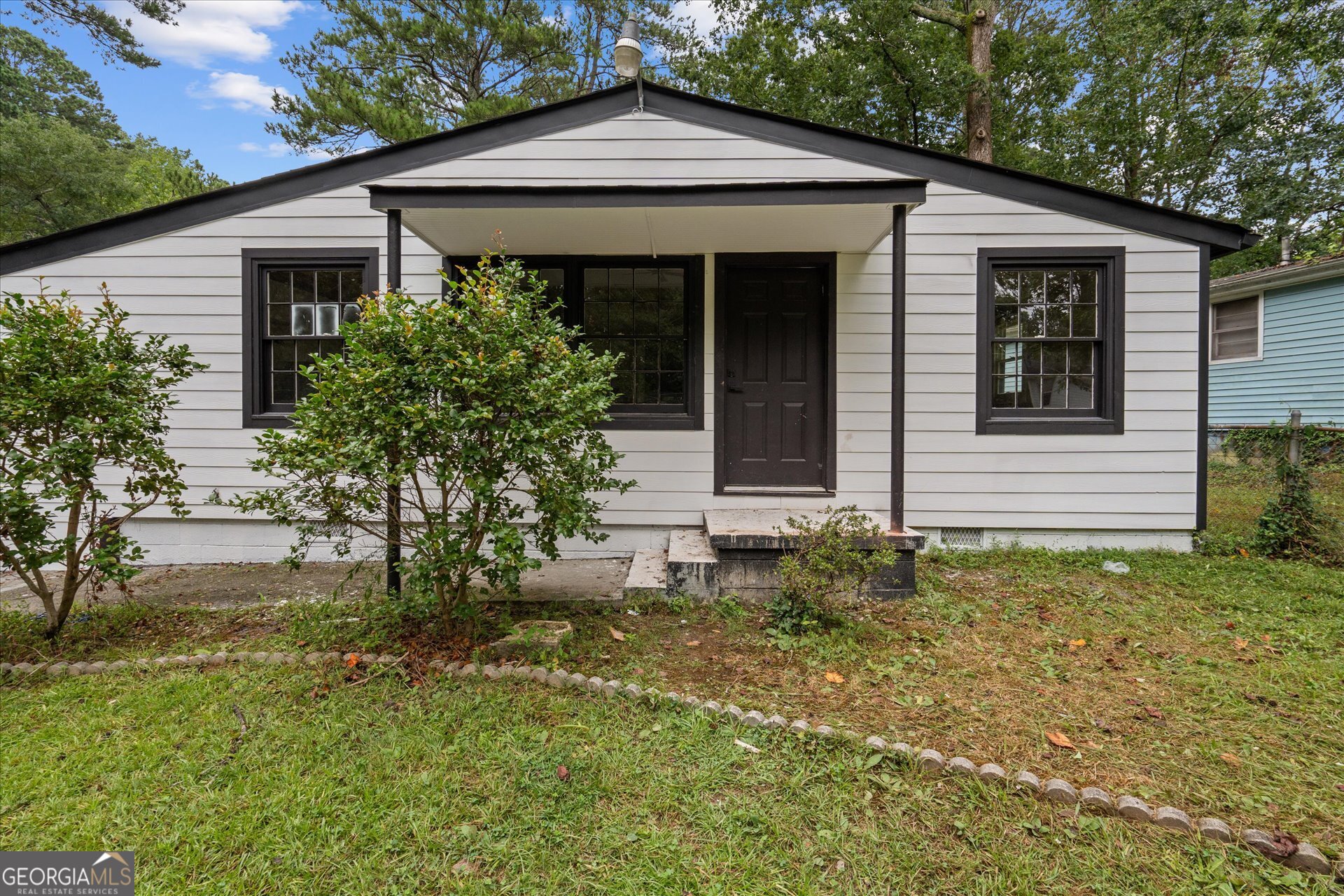 3102 McKenzie Road East Point, GA 30344 - Photo 5 of 31 front view of a house with a yard