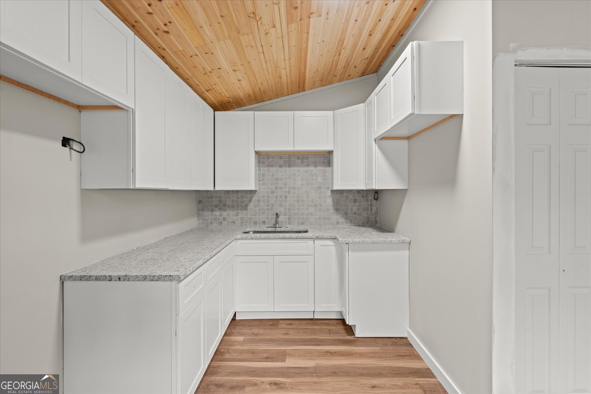 3102 McKenzie Road East Point, GA 30344 - Photo 10 of 31 a kitchen with a sink and cabinets