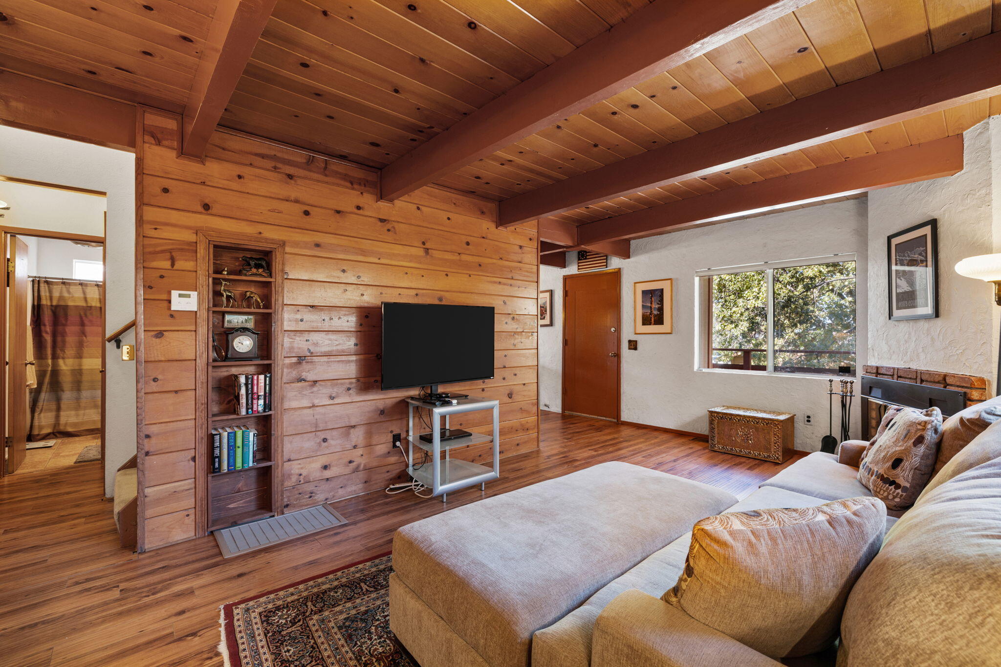 54370 Valley-View Idyllwild, CA 92549 - Photo 12 of 35 a living room with furniture and a flat screen tv