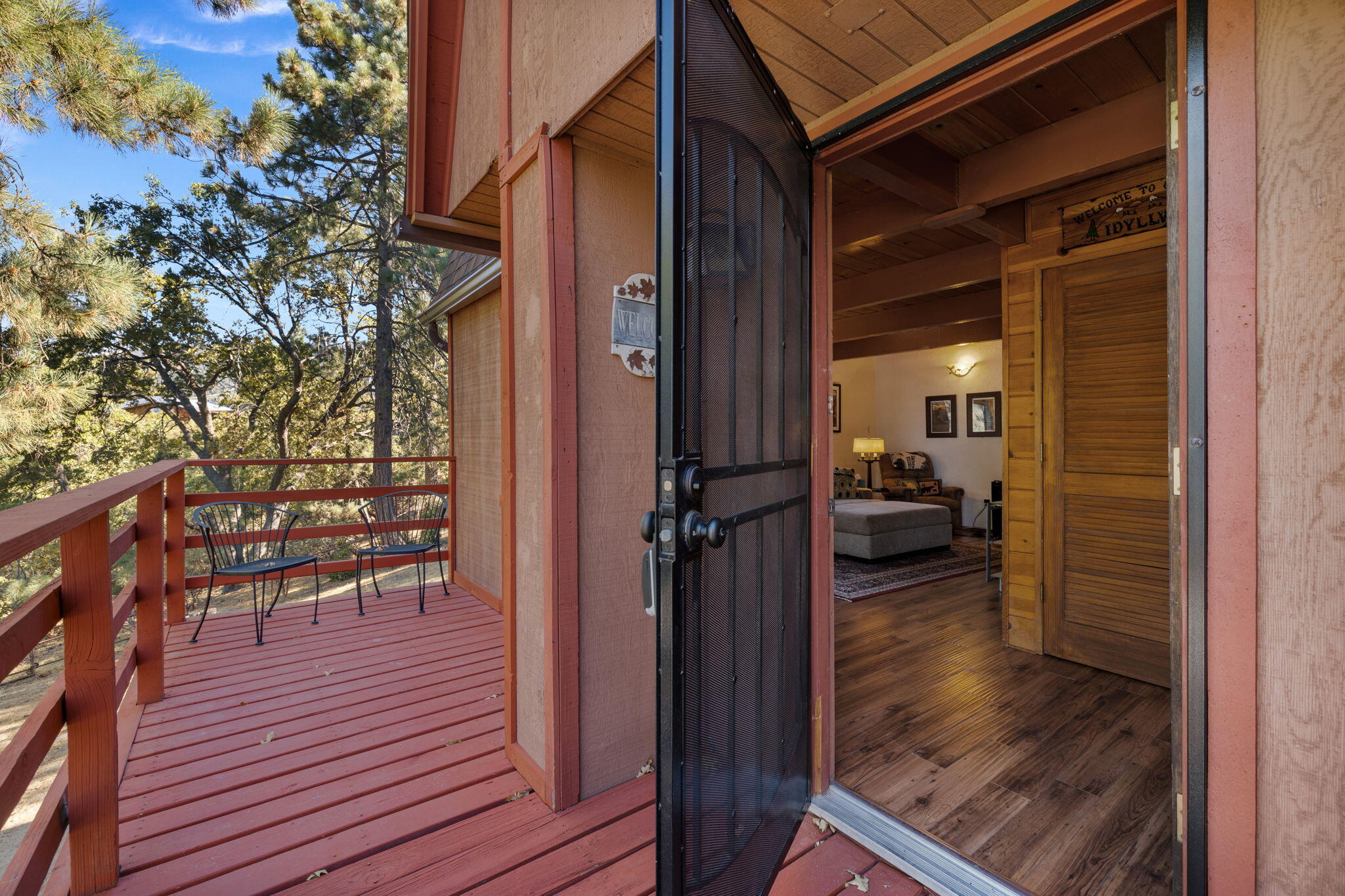 54370 Valley-View Idyllwild, CA 92549 - Photo 9 of 35 a view of a balcony and chairs and wooden floor